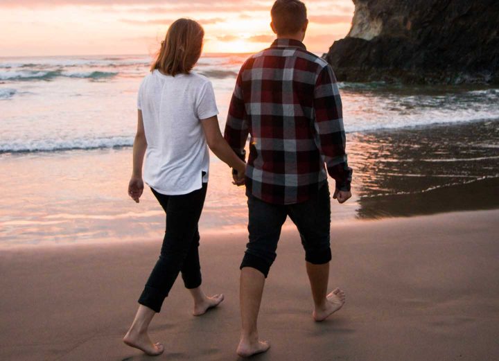 A couple walking at the beach
