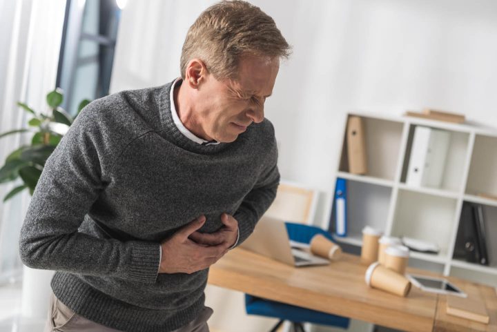 A man having a heart attack right in his office
